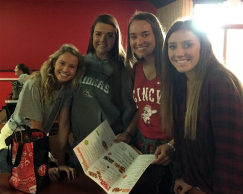 Seniors Avery Salyer, Jessica Doza, Alexa Hasting and Taylor Izzard deciding what to get for lunch at the senior bowling trip. 