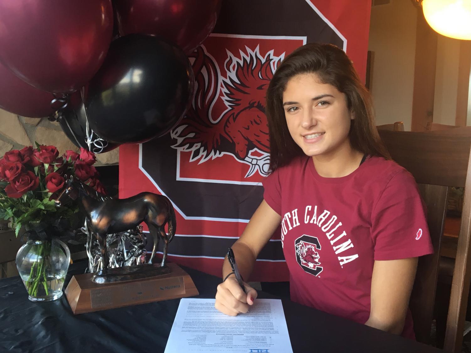 Thorpe signing the National Letter of Intent to join the University of South Carolina's equestrian team.