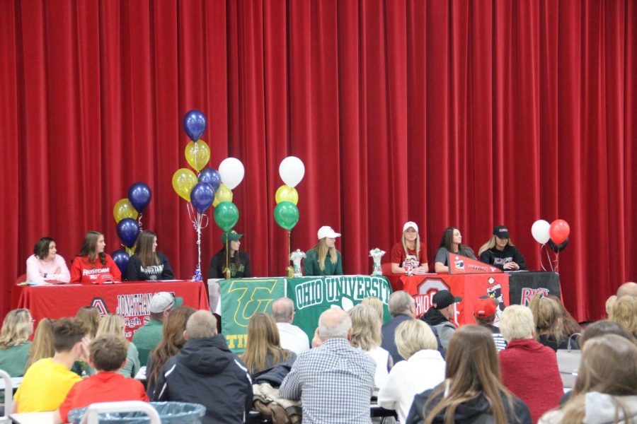 The seven senior prepare to sign to their chosen schools