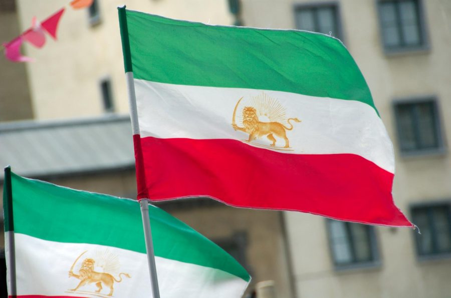 The flag of Iran proudly waves against the gusts of wind, courtesy of 