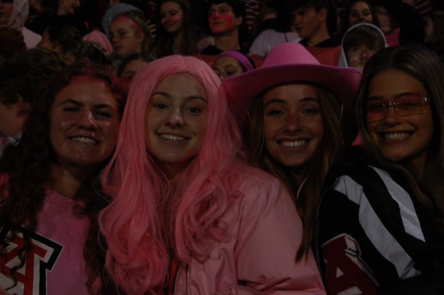 Senior Renci Ricker, Lauren Howell, Reagan Gray, and Olivia Zuro having some fun in the student section. 