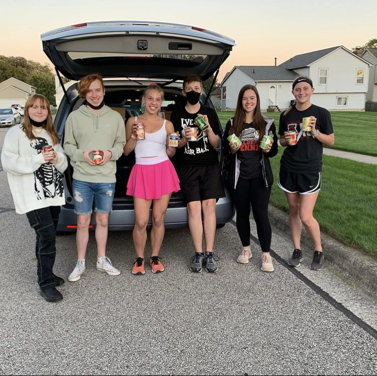 JAHS LEO Club goes trick or treating for canned goods around Plain City.