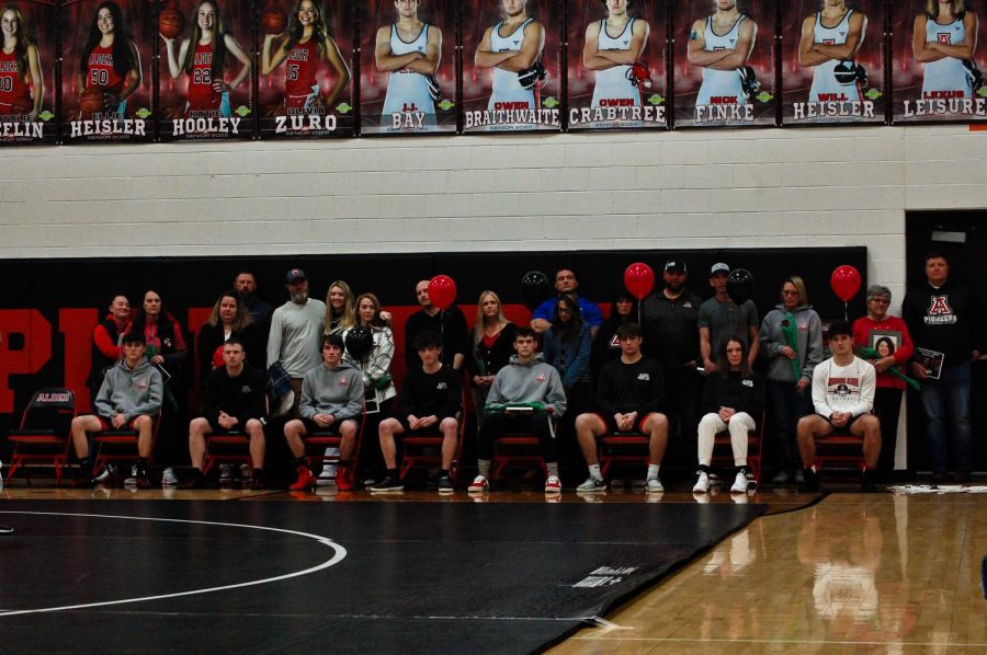 All eight of the wrestling seniors together for a picture. 