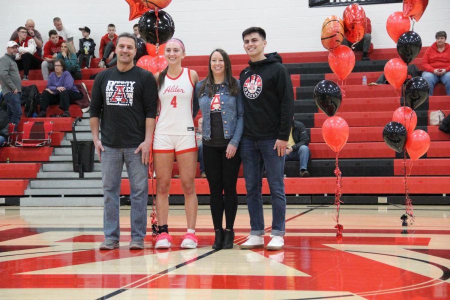 Senior Mary Ferrito with her parents and brother.