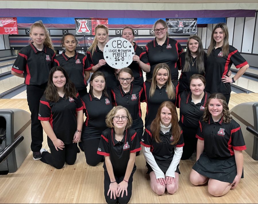 The girls bowling team celebrating a clean sweep for the CBC conference.