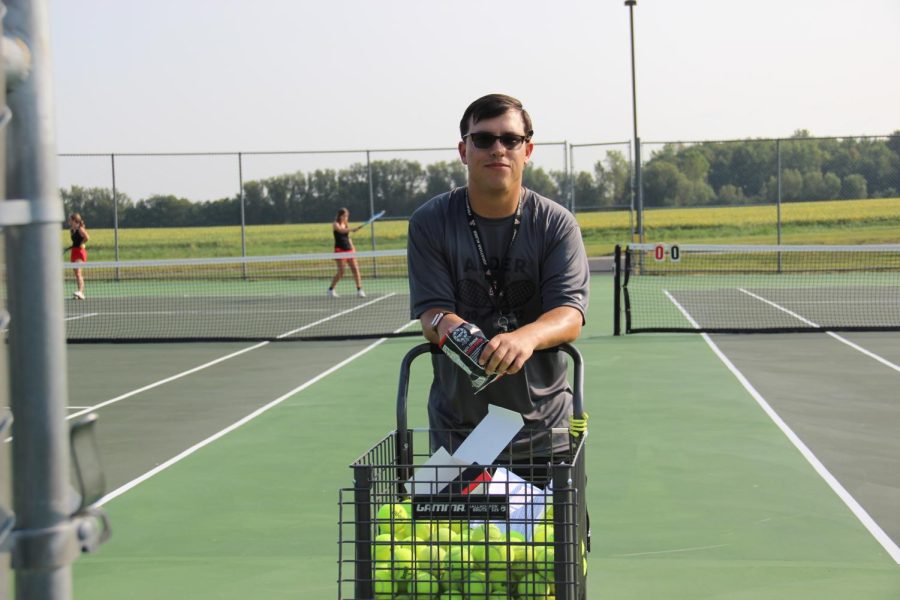 Deeken+enjoying+a+bag+of+chips+on+the+tennis+courts+