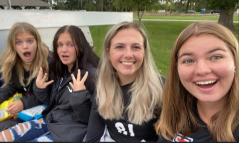 (Left to right) Kylie Kitchen, Lauren Ruetsch, Johanne Lothe, and Claire Warren pose for a picture on their soccer parade float. 