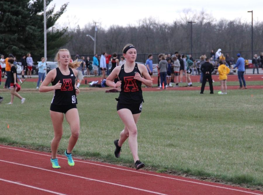 Alder track athletes run on the Marysville High school track.