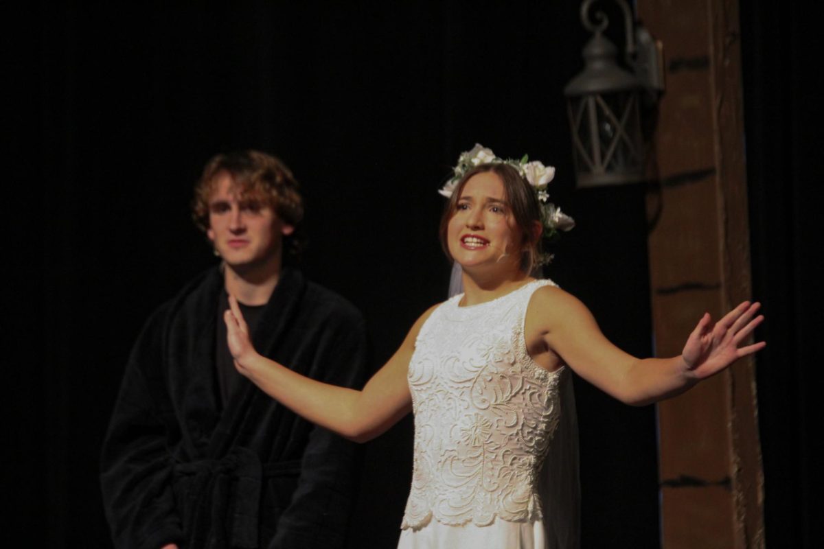 Freshman Lily Talik, acting during the play the Cross Winds Over the Saanich Inlet.