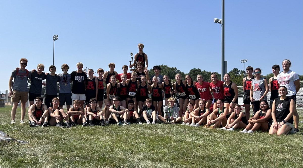 Both cross country teams gather for a photo. 

Photo Courtesy of Ella Luker