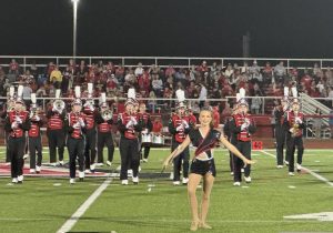 The Jonathan Alder Marching Band begins to perform for their half-time performance.