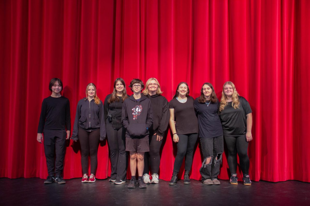 Stage crew poses for a photo.