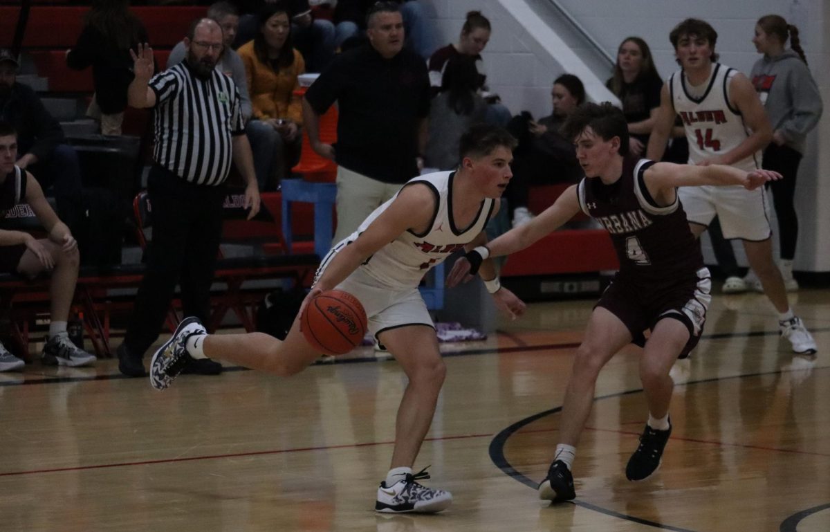 Senior Ryan Mark runs past the Urbana defender and towards the net.