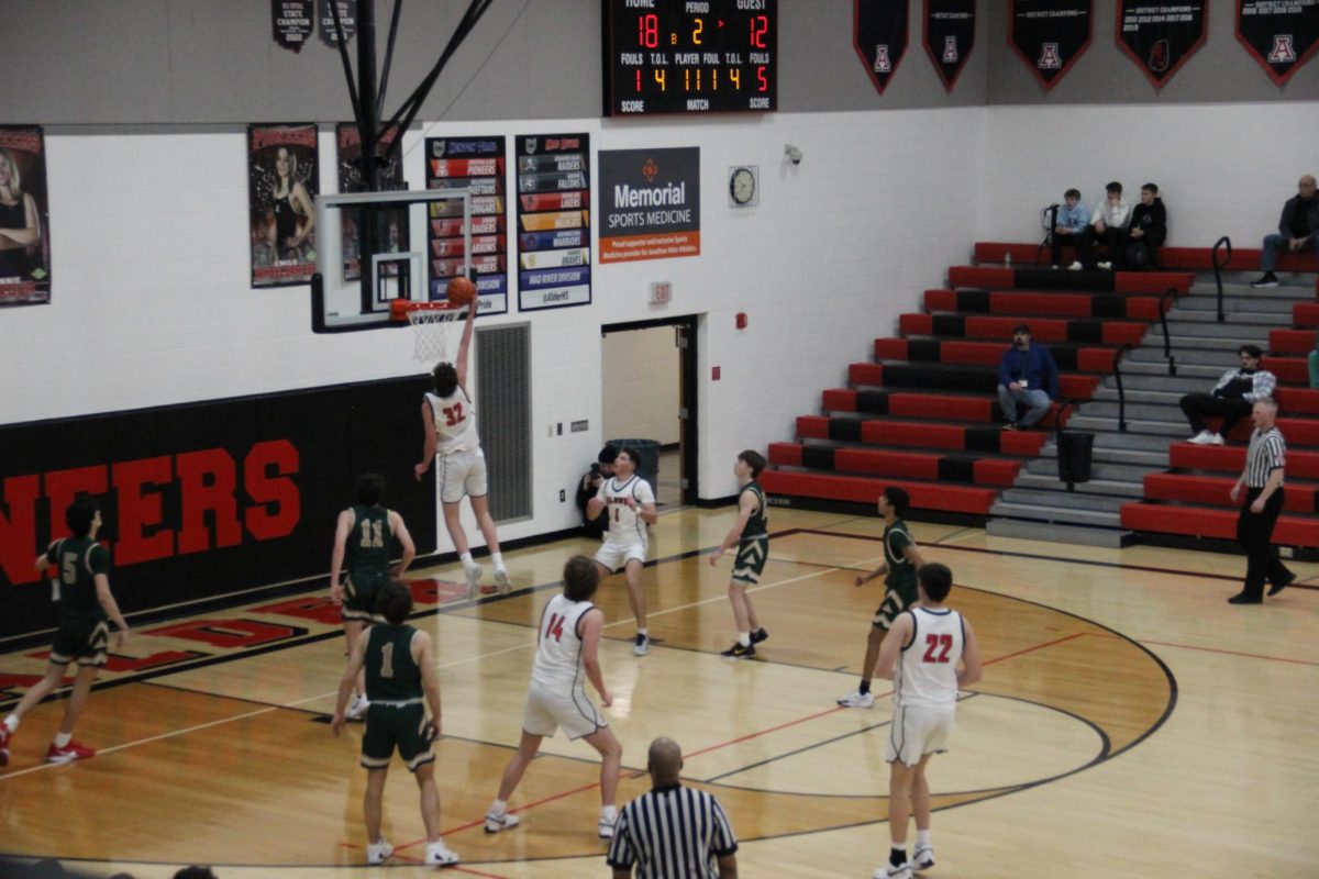 Senior Sam Cramer makes a slam dunk.