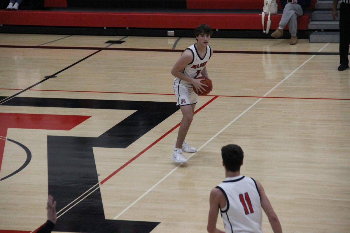 Freshman Trey Bentley passes the ball to freshman Danny Bentley.