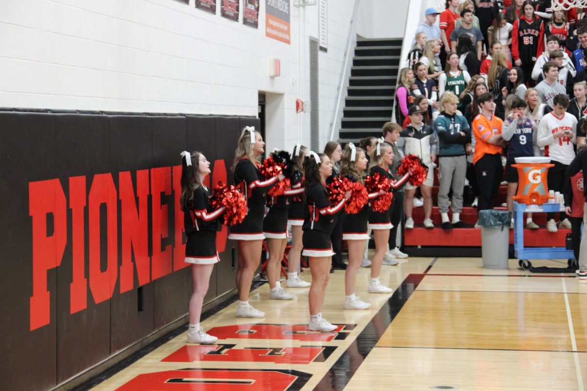 Alder cheerleaders cheer and support from the sidelines.