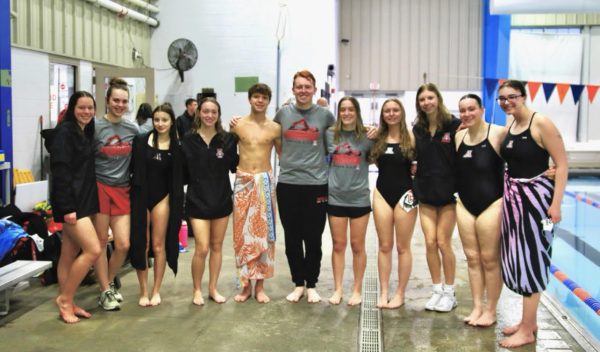 The swim team poses for a photo. 

Photo courtesy of Megan Ahner