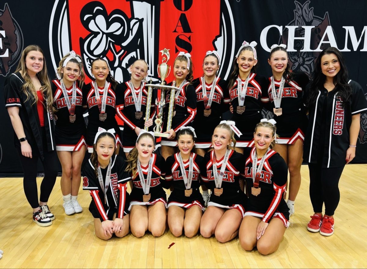 Jonathan Alder cheer team takes a photo together after winning state championships. 

Photo Courtesy of Abbigail Lewis