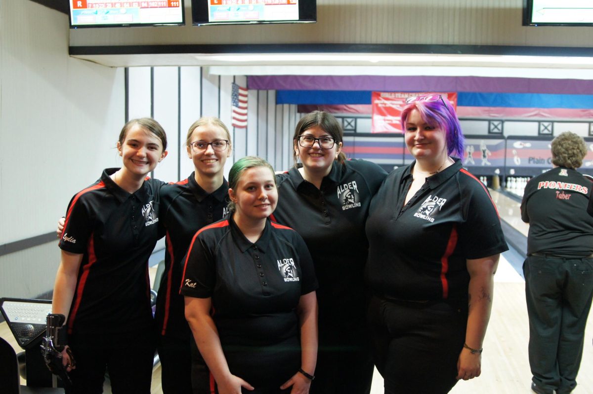 Members of the girls bowling team (LR: Freshman Lydia Roseberry, sophomore Evelyn Simmons, junior Kat Carson, senior Caitlyn Feay, and senior Addie Wilkin) pose for a photo. 