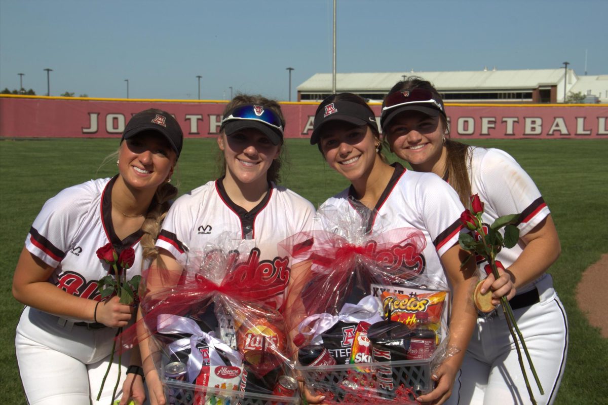 Several team members line up for a photo. (L-R: juniors Goldie Bowshier, Raegan Tremayne, Maggie McCoy, sophomore Lucy Boyd)