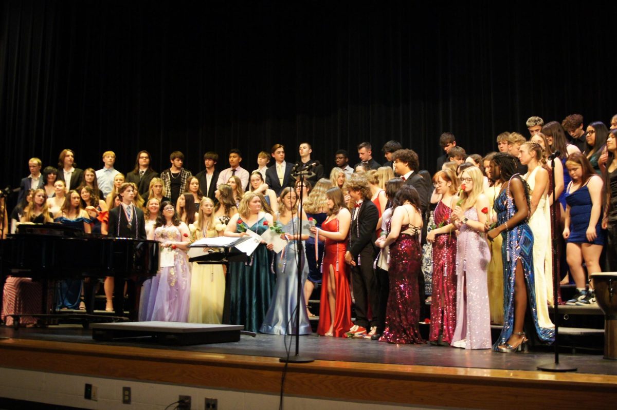 The choir prepares to sing after seniors received cords.