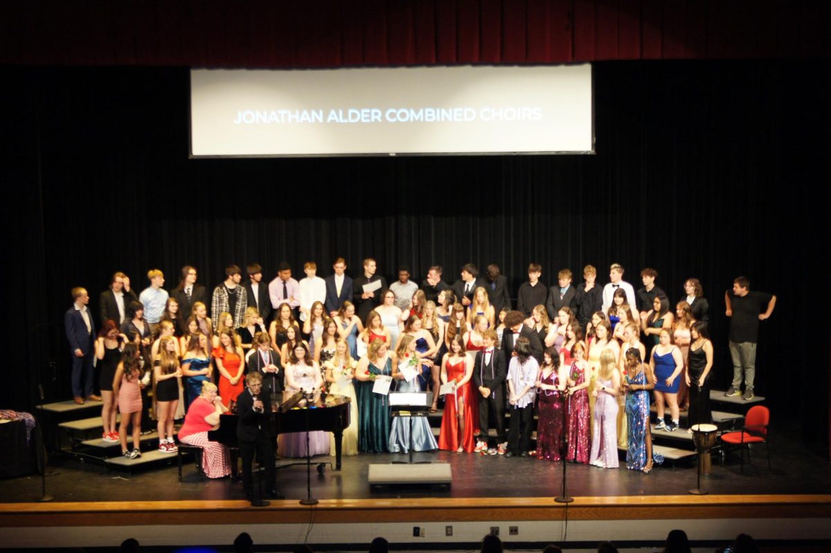 All choirs combind sing the closing piece of the year.
