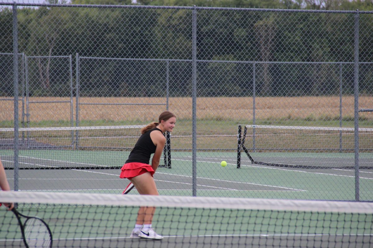 Senior Katie Sloat returns a hit.