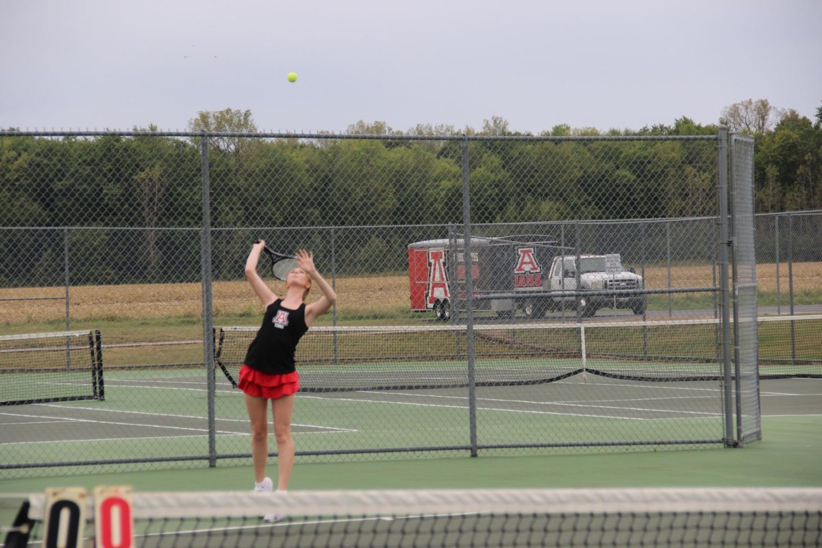 Senior Sarah Green serves a hit.