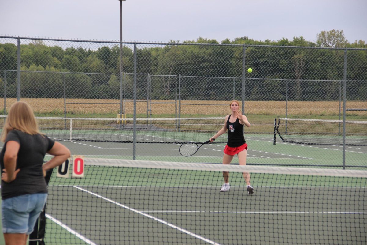 Green returns a serve hit to her.