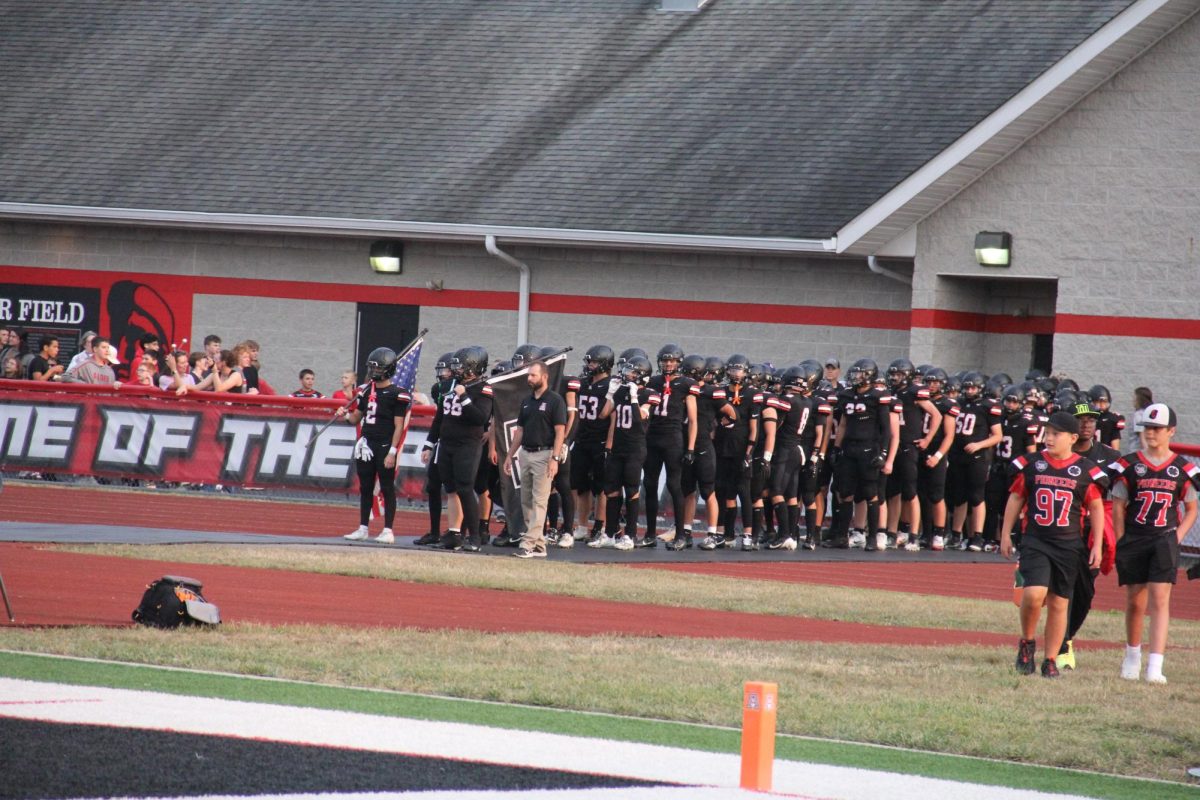 Brett Glass with the football team before a game. 