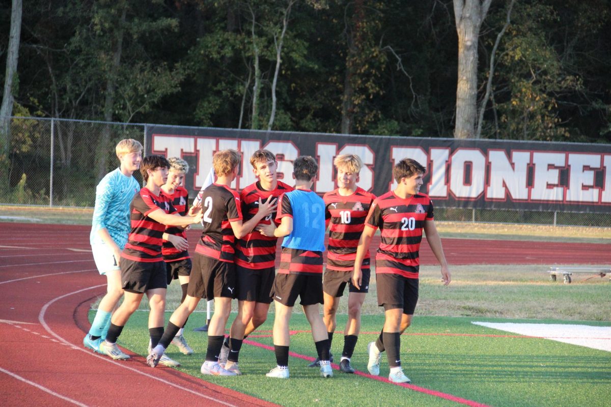 Hamill and the team celebrate his goal.