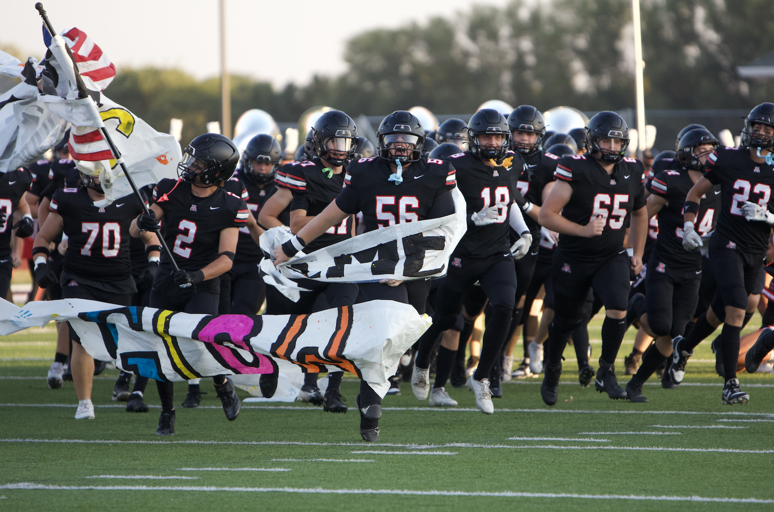 The Pioneers make their entrance for the game.