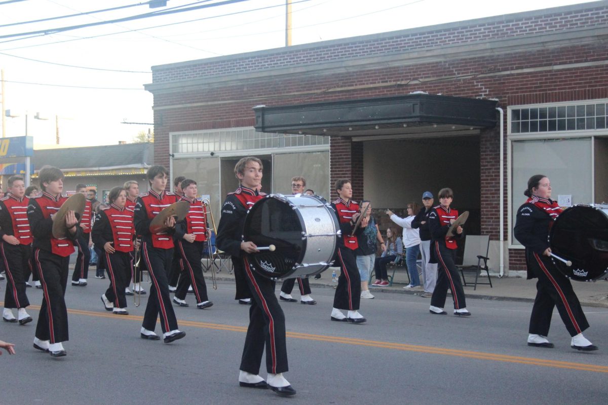 Jonathan Alder High School's drum line marches down main street. 