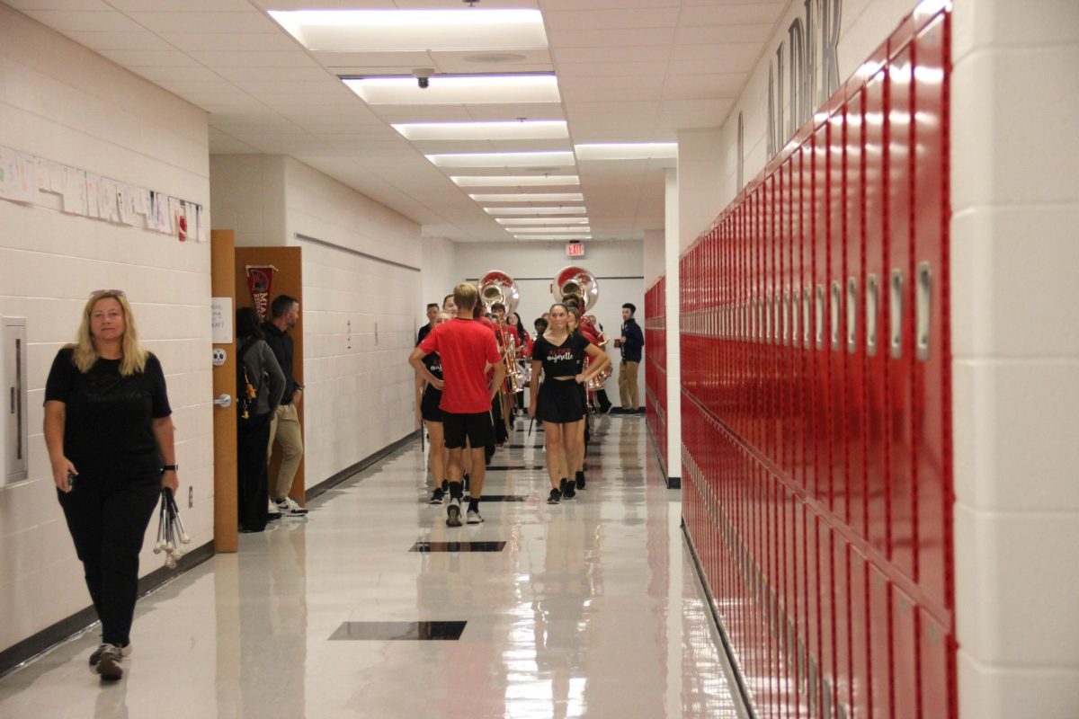 JAHS Marching Band marches through hallway to get the pep rally started.