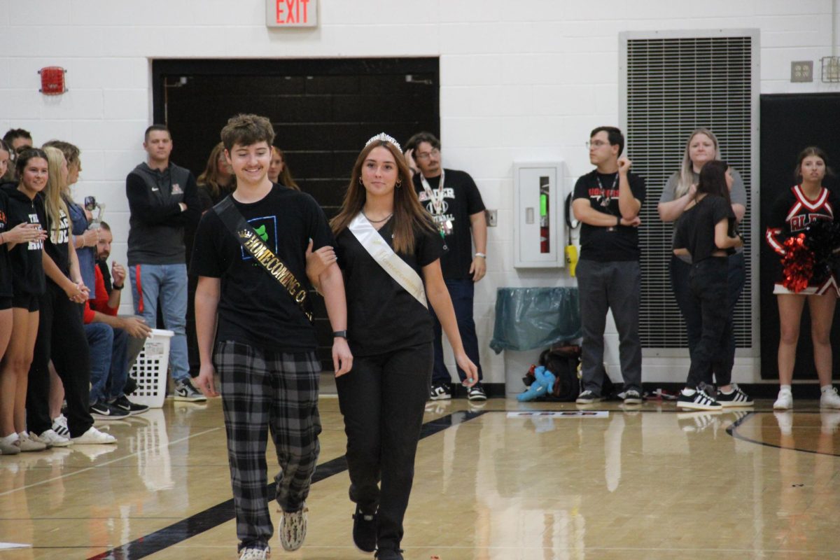 Senior Homecoming Court members, Emiy Webb and Myles Guthrie, are announced.