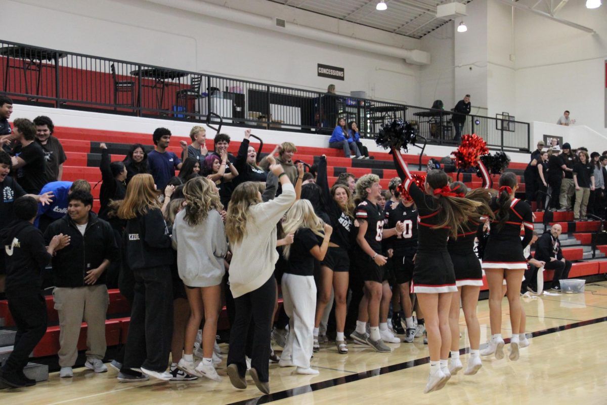 Juniors cheer for the spirit stick competition.