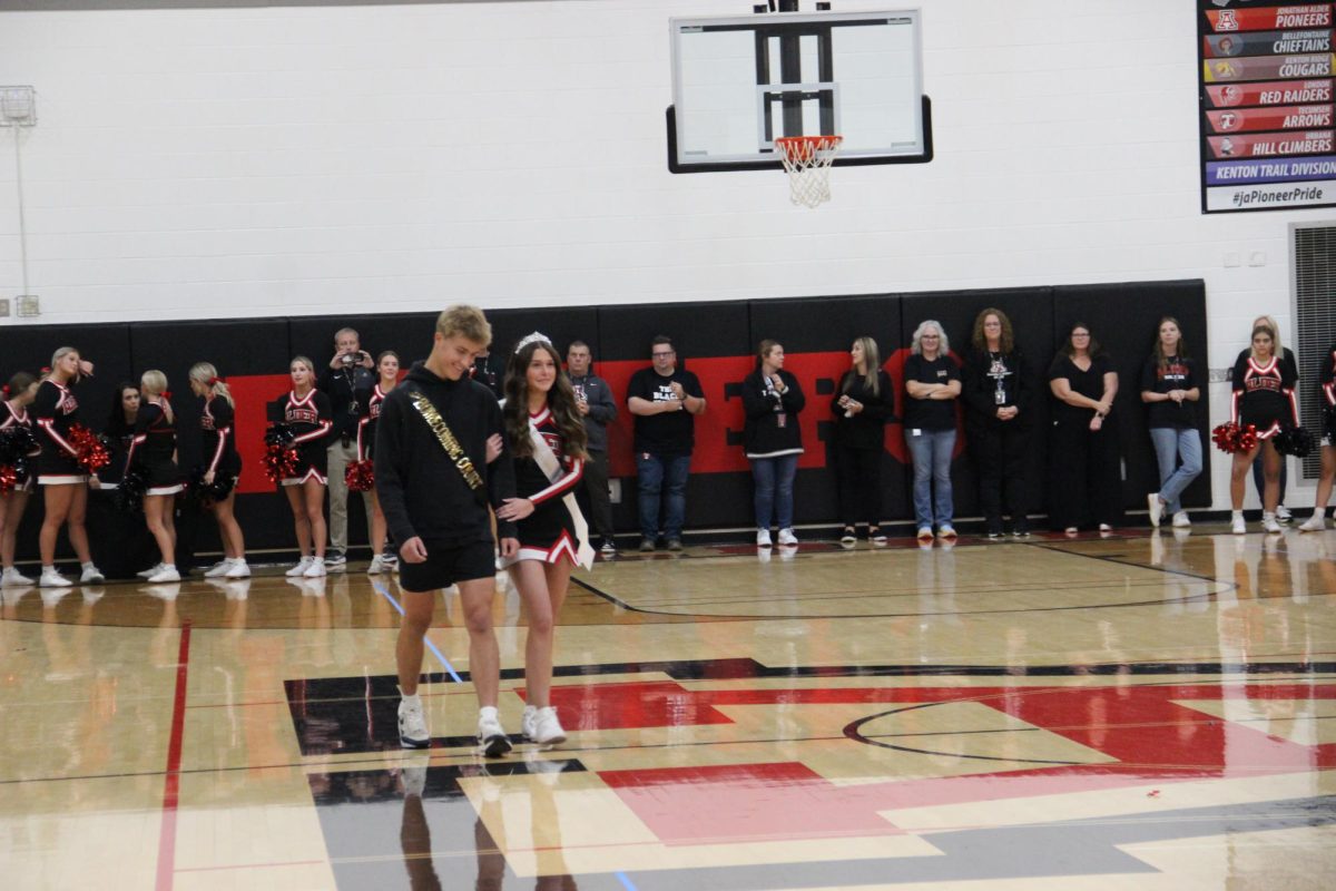 Homecoming court members Walker Martini and Reese Fry are recognized. 
