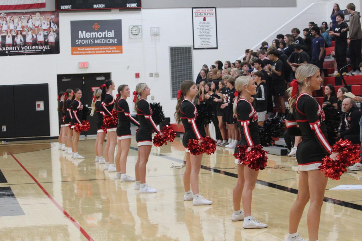 Junior and senior cheerleaders line up to lead cheers.