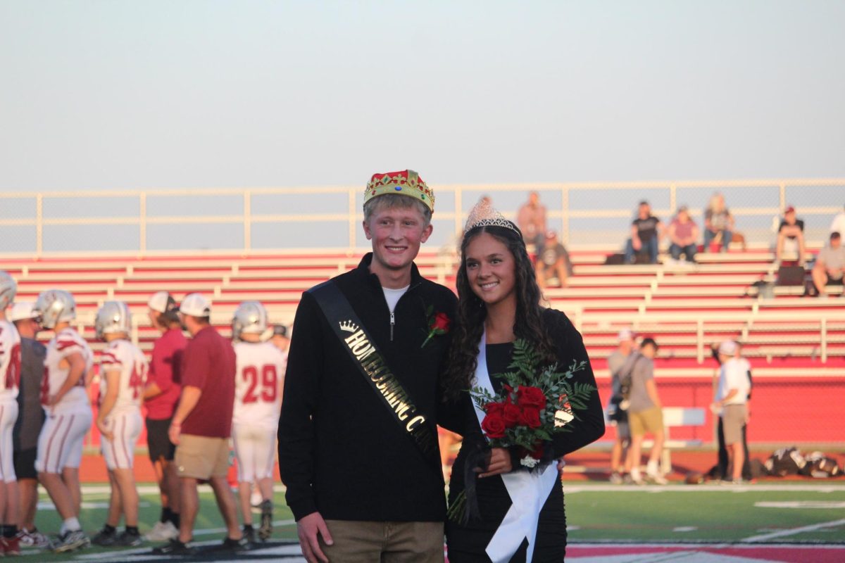 Senior attendees Calla Streit and Mark Goode pose for a photo after being announced king and queen.