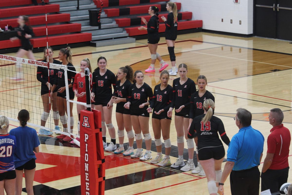 The team give high fives to sophomore Annalise Hayes.