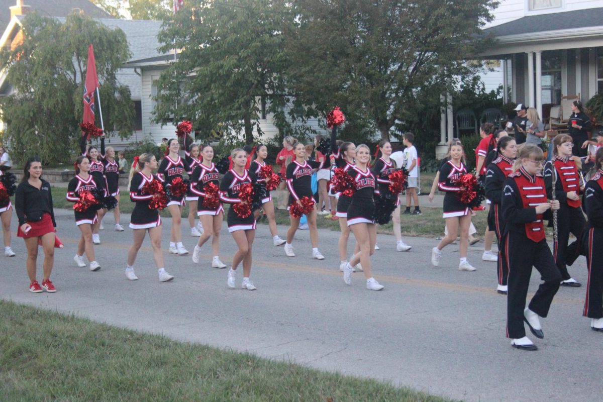 The Jonathan Alder High School's cheer team shows their school spirit at the parade. 