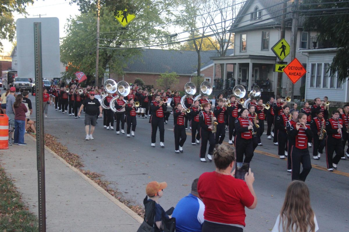 The band approaches the entrance to Pastime Park to end the homecoming parade. 