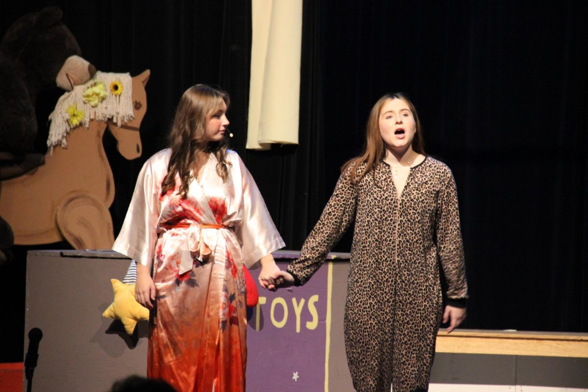 The Tiger Lily (sophomore Allie Moran) and a lost boy (sophomore Giuliana Dellapina) talk to the audience.
