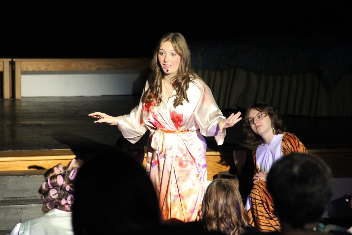 The Tiger Lily (Moran) introduces the story to the crowd.