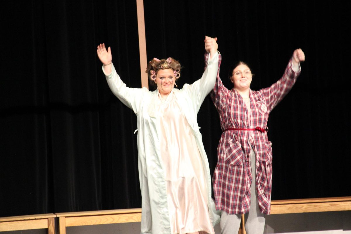 Mrs. Darling (Neeley) and Mr. Darling (Waugh) take their final bow.