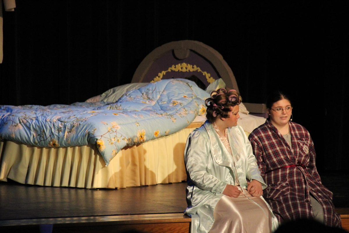 Mrs. Darling (senior Hailey Neeley) listens to Mr. Darling (senior Sam Waugh) as their daughter, Wendy, sleeps (McCabe).