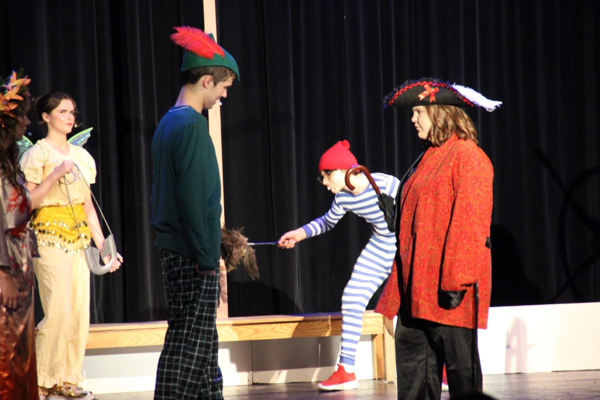 Peter Pan (Gregory) confronts Captain Hook (Karasek).