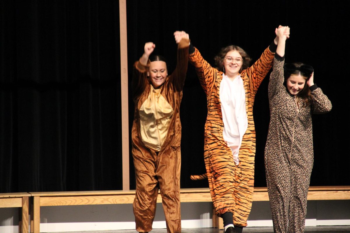 The lost boys (L-R: sophomores Hailey Duke, Averie Rhoades, Dellapina) take a bow.