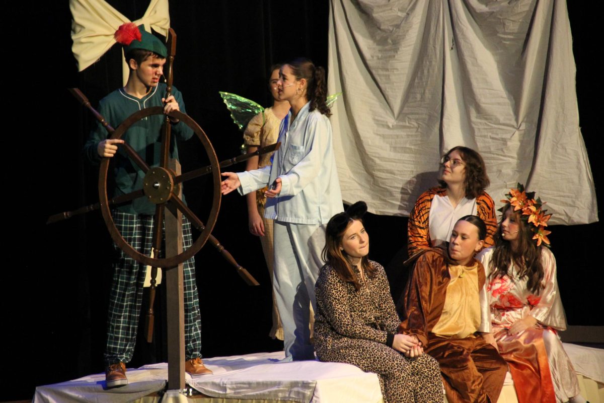 Peter Pan (Gregory), Wendy (McCabe), Tinker Bell (Robirds), the lost boys (Dellapina, Rhoades, Duke) and The Tiger Lily (Moran) on a pirate ship. 