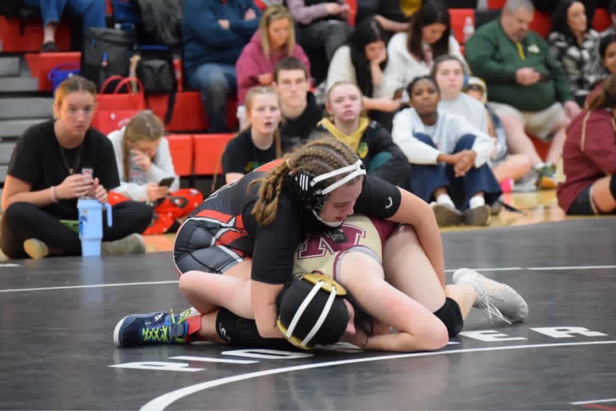 Junior Allison Funk pins a girl at the Lady's Pioneer Classic.

Photo courtesy of Ava Ater.